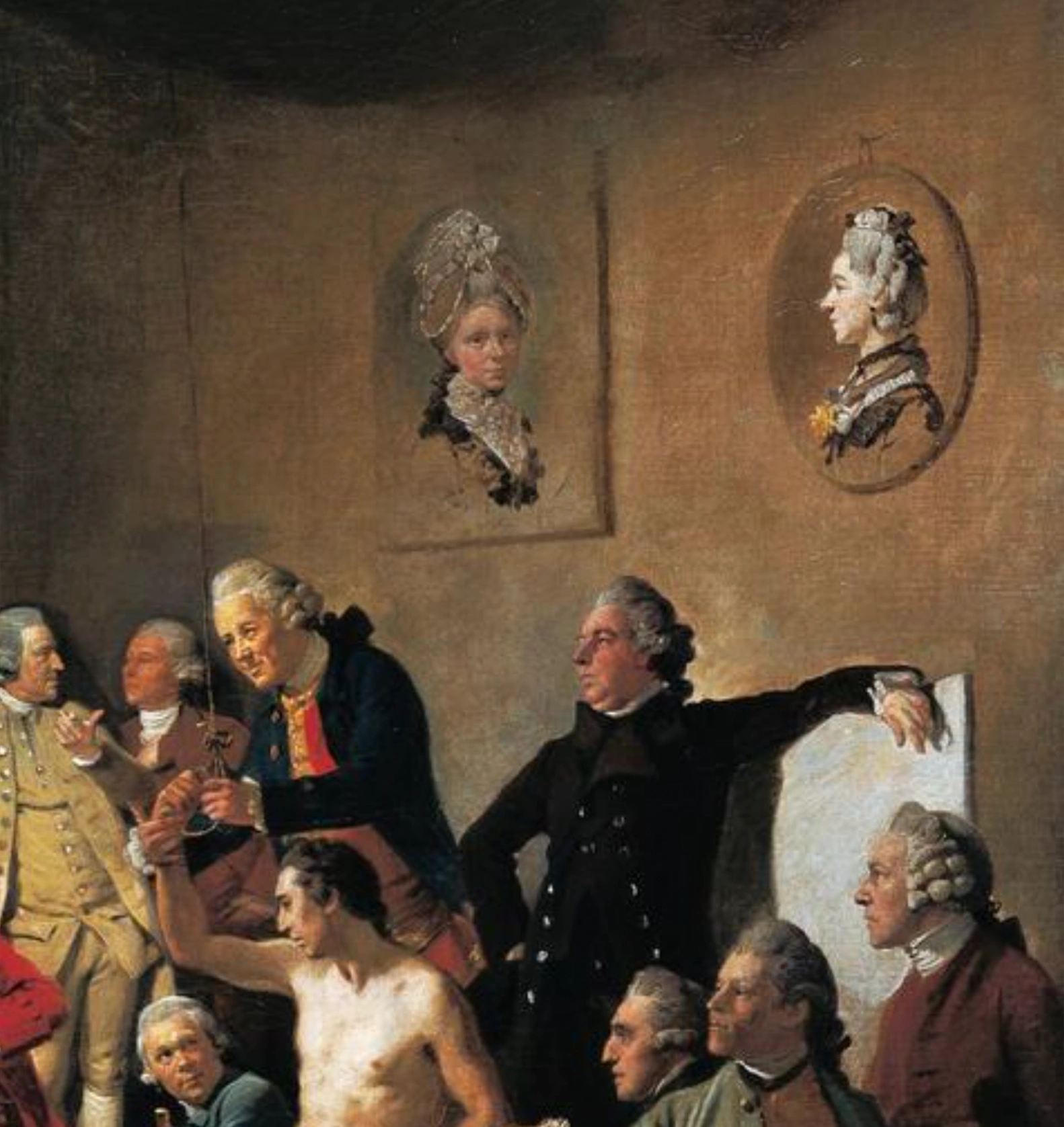 Nel dipinto di Johan Zoffany che rappresenta gli accademici riuniti (1771–1772), le due artiste compaiono solo come ritratti appesi al muro, Angelica a sinistra e Mary sulla destra, simbolo dell’esclusione delle donne dalle lezioni di nudo e da alcune attività fondamentali della formazione artistica.