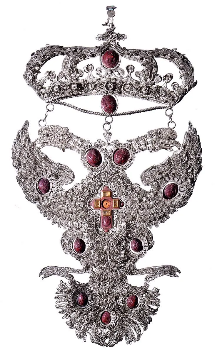 Properzia de’ Rossi e Giacomo e Andrea Gessi (attr. ), Stemma della famiglia Grassi , filigrana d’argento, parti fuse, cristallo di rocca, legno di bosso, noccoli, 39 x 22 cm, Museo Civico Medievale, Bologna.